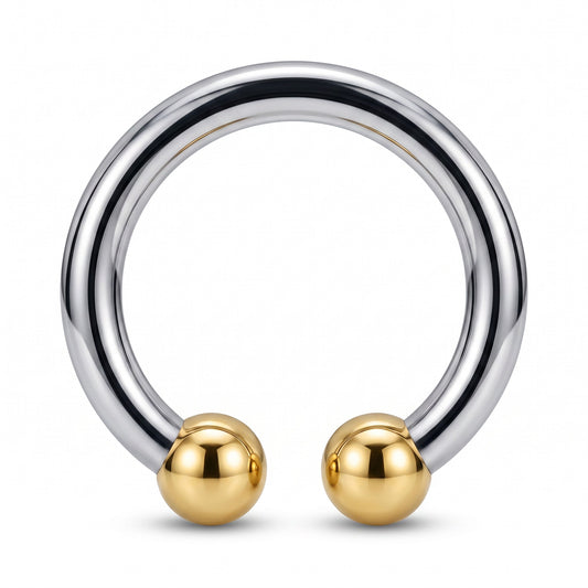 The Horseshoe Glans Ring is a premium metal ring expertly crafted from AISI 304 SURGICAL STEEL. Featuring a sleek mirror-polished finish with smooth edges and a golden tip accent, this ring combines durability with refined industrial style. Its balanced structure ensures comfortable wear while maintaining a strong, corrosion-resistant design. The silver body paired with a golden tip adds a sophisticated touch, making this piece ideal for those seeking a stylish and lasting metal accessory.