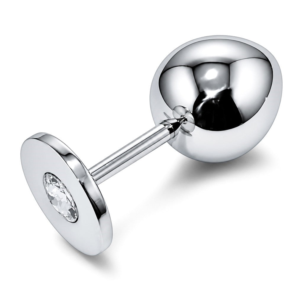 Experience a blend of luxury and functionality with the Perfectra Distribution Butt Plug with Stand &amp; Crystal. Crafted from premium Stainless Steel, this plug offers a smooth, durable surface that is easy to clean and designed for comfort.