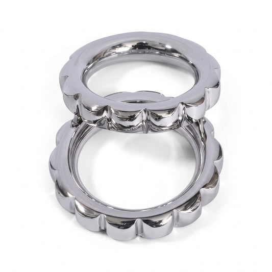 The Steel Button Strap Cock & Glans Ring offers a premium combination of durable metal and adjustable fit for reliable support and enhanced sensation. Crafted with AISI 304 SURGICAL STEEL, this dual-ring design provides firm control at the base and focused stimulation around the glans.